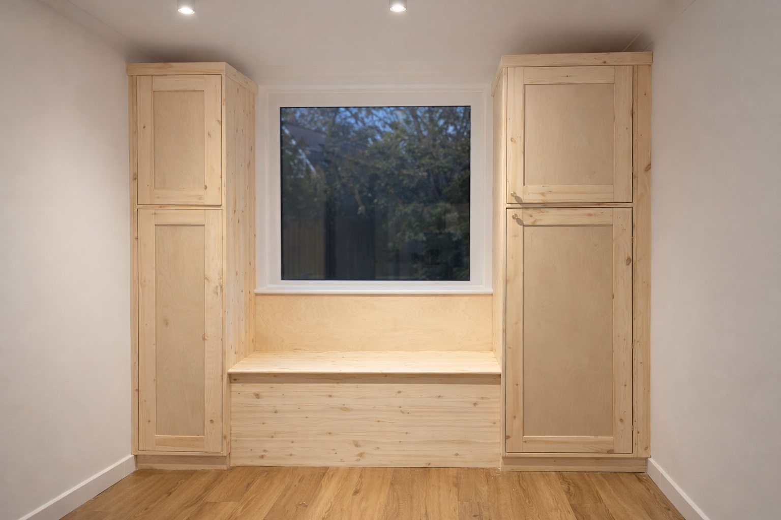 Finished natural timber window seat with fitted cupboards