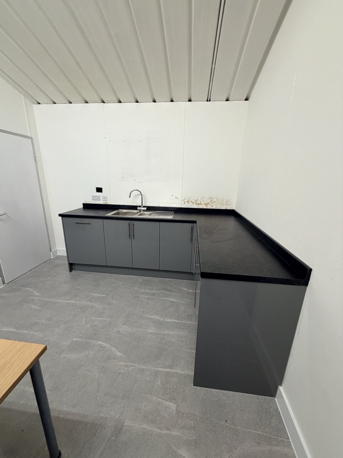 Finished compact grey kitchenette