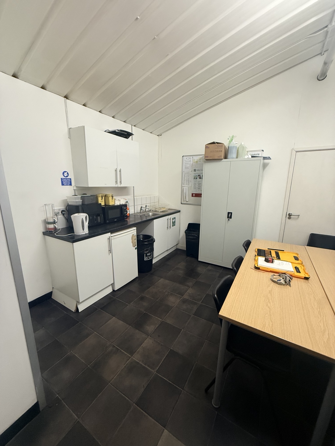 Dated kitchenette before renovation